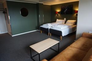 Postel nebo postele na pokoji v ubytování Verdde Hotel Lakselv
