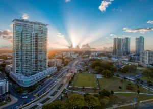 a city skyline with a tall building and a highway at ZANZIBAR FANTASTIC 1 Bedroom APARTMENT in Gold Coast