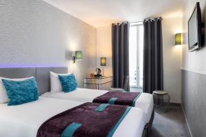 Postel nebo postele na pokoji v ubytování ATN Hôtel