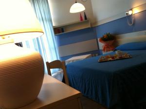 Posteľ alebo postele v izbe v ubytovaní Hotel Select