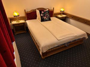 Postel nebo postele na pokoji v ubytování Éllő Residence
