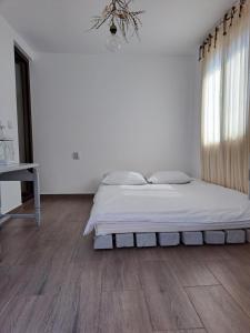 Postel nebo postele na pokoji v ubytování Luna
