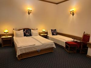 Ein Bett oder Betten in einem Zimmer der Unterkunft Éllő Residence