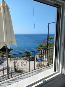 a view of the ocean from a balcony at Stafylos Rooms in Stafylos