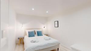 Posteľ alebo postele v izbe v ubytovaní Appartements modernes avec véranda