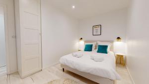 Posteľ alebo postele v izbe v ubytovaní Appartements modernes avec véranda