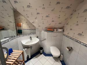 Et badeværelse på Ferienhaus Brise - Skipper's Kabine