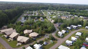 an aerial view of a small town with houses at Vakantiepark Camping de Peelpoort in Asten-Heusden