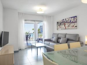 a living room with a couch and a table at Apartamentos Hipocampos Calpe Rent Apart in Calpe
