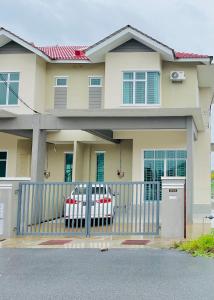 a house with a gate in front of it at Anjung Rindu Homestay (Kuala Terengganu, UMT, UniSZA) in Kuala Terengganu +13 photos