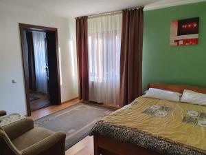 Postel nebo postele na pokoji v ubytování Perla Padurii + 37 fotografií