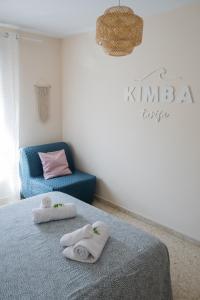 Postel nebo postele na pokoji v ubytování Kimba