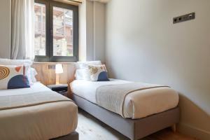 Postel nebo postele na pokoji v ubytování Nheu d'Arties by FeelFree Rentals