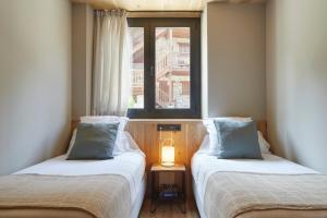 Postel nebo postele na pokoji v ubytování Nheu d'Arties by FeelFree Rentals