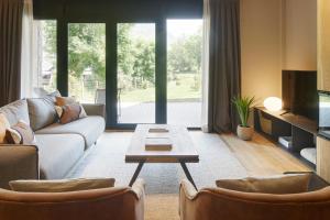 Posezení v ubytování Nheu d'Arties by FeelFree Rentals