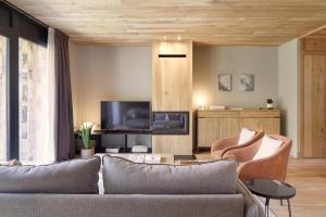 TV a/nebo společenská místnost v ubytování Nheu d'Arties by FeelFree Rentals