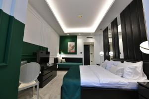 Voodi või voodid majutusasutuse Royal Wellness and Spa toas +37 fotot