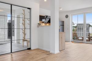 Μια τηλεόραση ή/και κέντρο ψυχαγωγίας στο Ferienhaus Wave