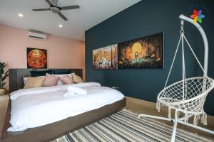 a bedroom with a bed and a swing at Private Studio in Bungalow by LilyandLoft in Subang Jaya