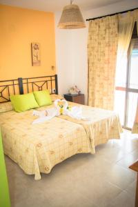 Posteľ alebo postele v izbe v ubytovaní Hostal Malia