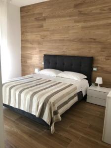 Posteľ alebo postele v izbe v ubytovaní Appartamenti Villa Miramare
