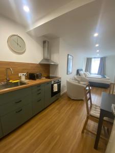 a kitchen with a sink and a counter top at Apartmany Tachov - Tiny House in Tachov