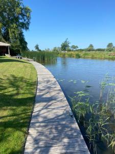 a path next to a body of water at Wetterwillefriesland in Wommels