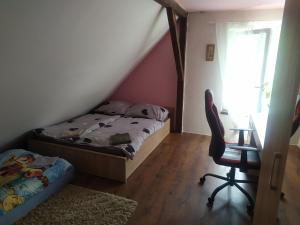 Postel nebo postele na pokoji v ubytování Apartmány u koní