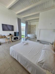 Postel nebo postele na pokoji v ubytování Pool Suite - Città Bianca + 25 fotografií