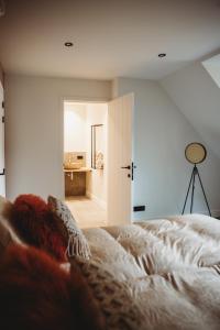 Ein Bett oder Betten in einem Zimmer der Unterkunft Eikenhoef