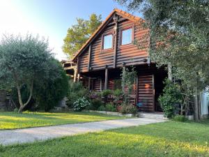 a log cabin with a path in front of it at Top of the hill - Paradise in Ulcinj