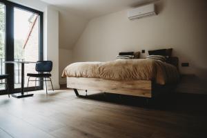 Ein Bett oder Betten in einem Zimmer der Unterkunft Eikenhoef