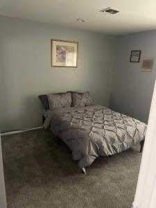 a bedroom with a bed in the corner of a room at Freeman Enterprises LLC in Las Vegas