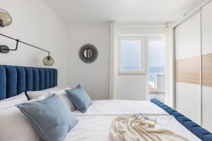Postel nebo postele na pokoji v ubytování Apartments Marina