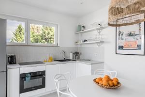 Kuchyň nebo kuchyňský kout v ubytování Apartments Marina
