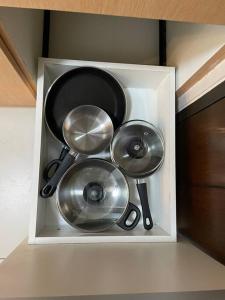 a white box filled with utensils in a kitchen at Cozy 1 BR One Uptown Residences BGC in Manila