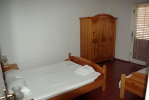 Postel nebo postele na pokoji v ubytování Vodice, apartmani Buntić