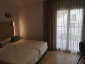 Hotel Coral Boutique by gaiarooms客房内的一张或多张床位