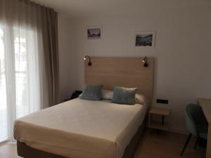 Hotel Coral Boutique by gaiarooms客房内的一张或多张床位