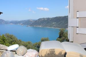 a view of a body of water from a building at Artistic Sea View House in Corfu