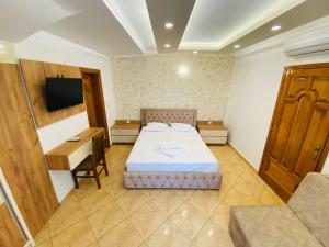 Ένα ή περισσότερα κρεβάτια σε δωμάτιο στο Apart Hotel Llolla