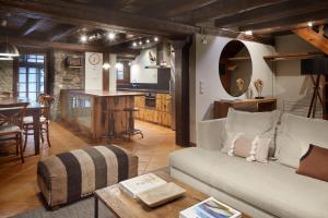 a living room with a couch and a table at Casa Montarto by FeelFree Rentals in Arties