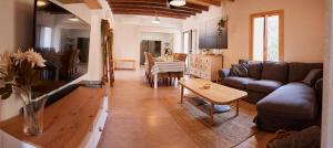 a living room with a couch and a table at Ses cases noves Llucmajor in Llucmajor