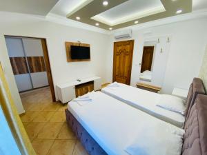 Ένα ή περισσότερα κρεβάτια σε δωμάτιο στο Apart Hotel Llolla