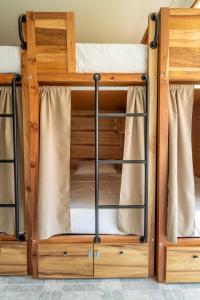 two bunk beds in a room at Lisbon Surf Hostel in Carcavelos