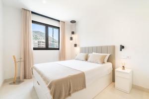 En eller flere senge i et værelse på HigueronRentals Majestic Alboran + 48 billeder