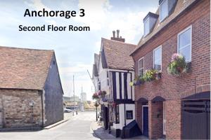 an image of an old brick building with a second floor room at Anchorage in Poole +19 photos