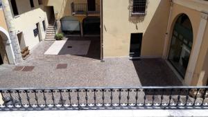 a balcony of a building with a stair railing at Lorenzo's House in Thiene