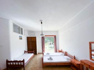 Postel nebo postele na pokoji v ubytování Stamiris Beach Hotel