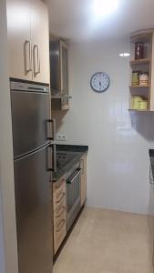 Kuchyň nebo kuchyňský kout v ubytování Apartamento Carabuxeira 1 + 3 fotografie